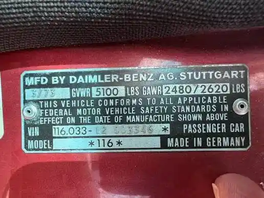 A Mercedes-Benz manufacturer's data plate showing VIN, GVWR/GAWR ratings, and model number — one of several locations where a car's VIN appears and should be cross-checked before buying